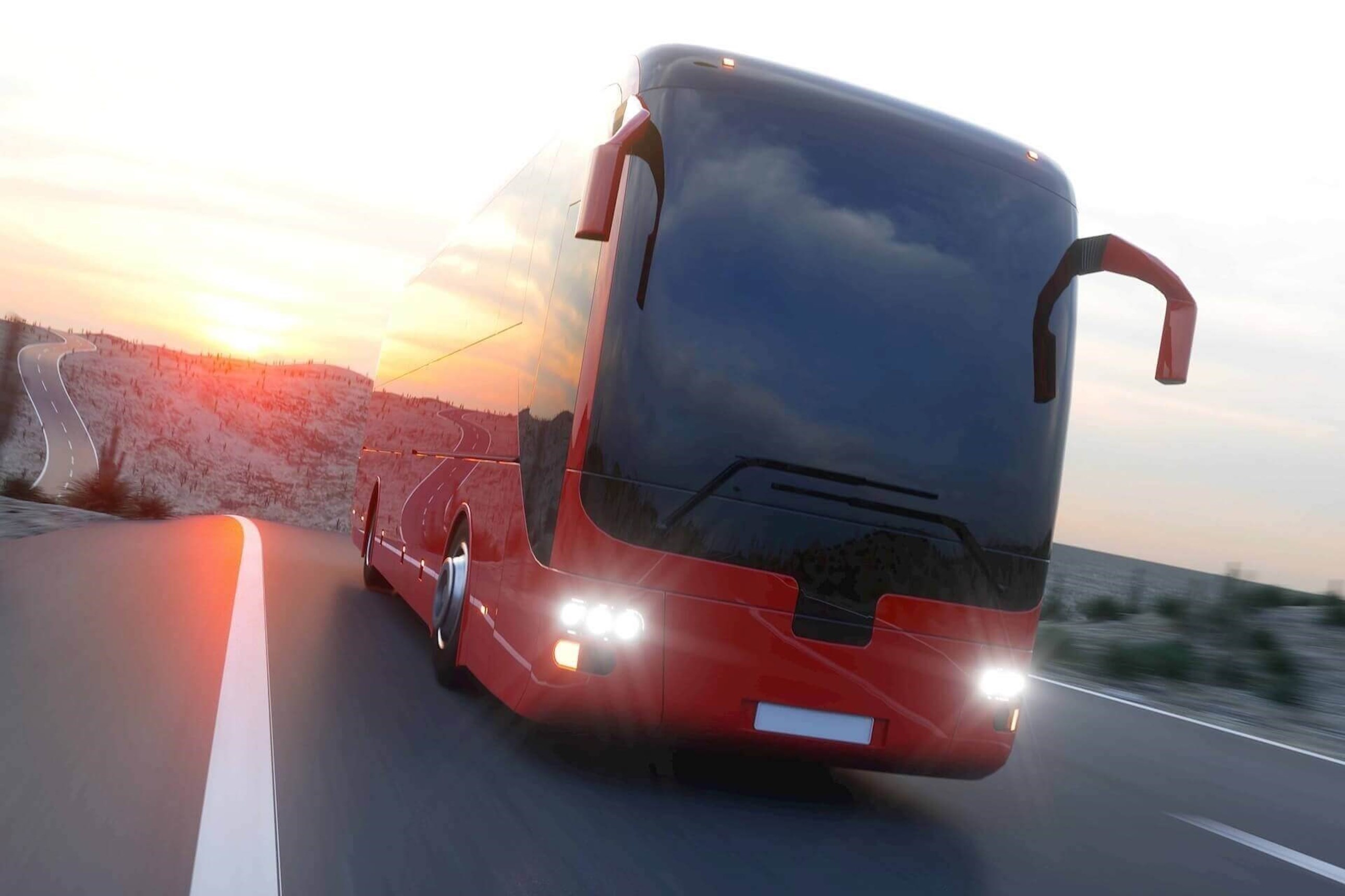 Bus on a road at sunset Bus on a road at sunset